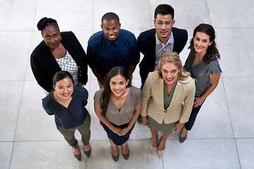 Aufkleber - Were the team for you. High angle portrait of a team of businesspeople posing together in their office.