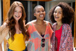 © Wavebreak Media - Portrait of cheerful multiracial female friends in casuals enjoying weekend at poolside on sunny day