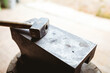 © Wavebreak Media - Close-up of hammer with wooden handle on anvil in manufacturing industry