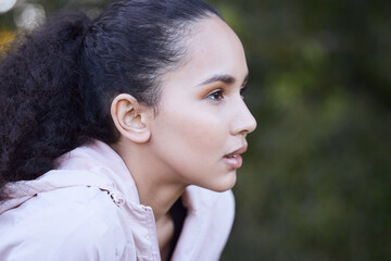 Take breaks but dont you dare quit. Shot of a beautiful young woman out for a run.