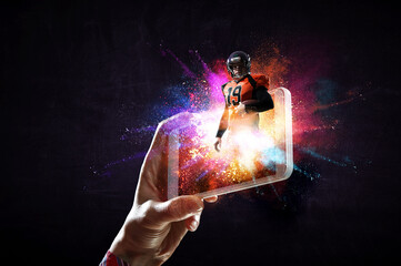 Wall Mural - Football player on mobile phone screen