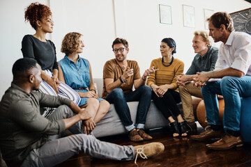 Poster - they boast a dynamic range of talents. shot of a group of designers having a discussion in an office