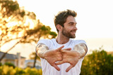 Focused on fitness. Shot of a man stretching before a run.