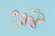 Sports shoes, pink sneakers, sunglasses and cute gingerbread on background. Summer time, childhood and holiday concept. Top view Flat lay