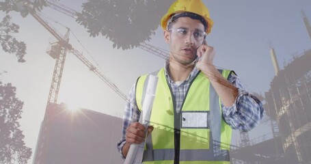 Poster - Animation of building site over caucasian male worker talking on smartphone