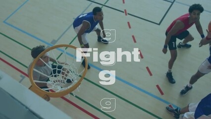 Canvas Print - Animation of fight texts over diverse group of male basketball players at gym