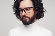 © kegfire - Serious bearded man in eyeglasses looking away pensively