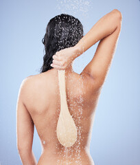 Wall Mural - Now I can wash my own back. Shot of an unrecognizable woman taking a shower against a blue background.