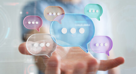 Wall Mural - Businessman using digital speech bubbles talk icons. Minimal conversation or social media messages floating over user hand. 3D rendering