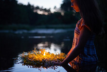 Young Girl With Wreath Late At Night, Sets It To Float. Ritual At Kupala Night
