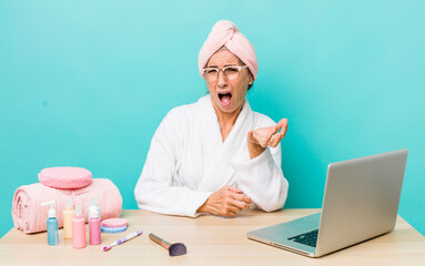 Wall Mural - senior gray hair woman looking angry, annoyed and frustrated.  skin care and shower concept