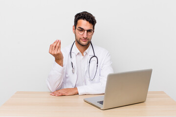 Wall Mural - hispanic handsome man making capice or money gesture, telling you to pay. physician concept