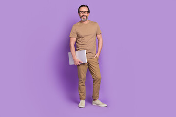 Sticker - Full length photo of mature man standing hold laptop representative isolated over violet color background