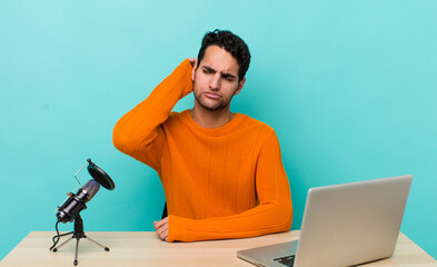 Wall Mural - hispanic handsome man smiling happily and daydreaming or doubting. influencer concept