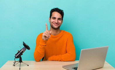 Wall Mural - hispanic handsome man smiling proudly and confidently making number one. influencer concept