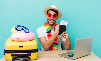 Poster - hispanic handsome man feeling happy and facing a challenge or celebrating. travel and tourism concept