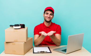 Wall Mural - hispanic handsome man smiling happily with friendly and  offering and showing a concept. packer employee concept