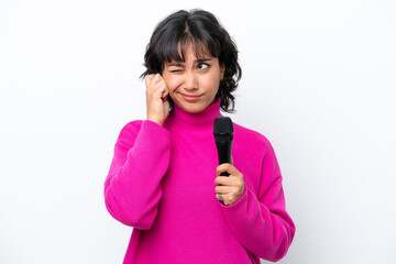 Sticker - Young Argentinian singer woman isolated on white background frustrated and covering ears