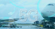 5g text and round neon scanners against airplane at the airport