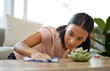 © C Coetzee/peopleimages.com - I almost missed a spot. Shot of a young woman cleaning a table at home.