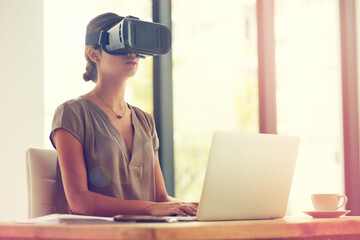 Aufkleber - Getting business done beyond the borders. Shot of a young businesswoman wearing a VR headset while working in an office.