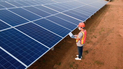 Wall Mural - Technician checking the panel in solar power station panels,Renewable ecological source of energy from the sun