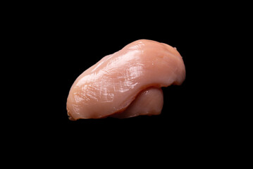 Wall Mural - Raw chicken fillet isolated on a black background.