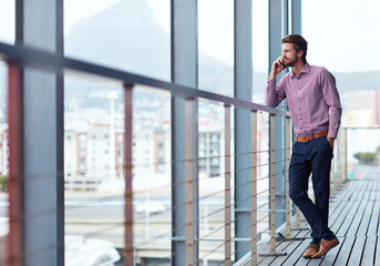 Aufkleber - Sustaining business relationships over the phone. Shot of a young businessman talking on a phone outside of an office building.