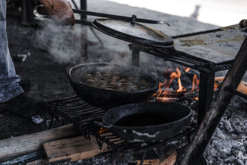 Closeup of the cauldron on the fire. Cooking outdoors.