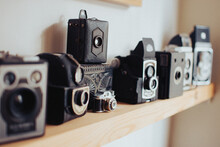Closeup Shot Of A Display Shelf Of A Collection Of Old Vintage Film Cameras