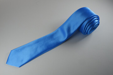 Blue polyester necktie isolated on a white background