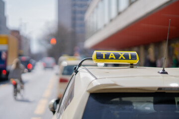 Sticker - Shallow focus shot of a taxi car in a city