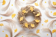 Autumn Time Background. Dry Grass Wreath With Ginkgo Leaves. Of White Flat Lay Fall Background With Dry Yellow Leaves And Pampas Grass.