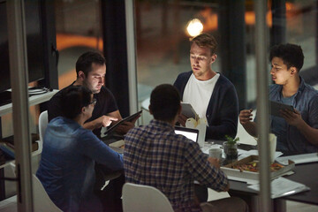 Aufkleber - Theyre the dream team. Shot of employees working in an office at night.