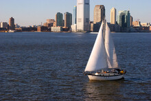 Boat In The Hudson River And Buildings Of New York City In The USA During Daytime