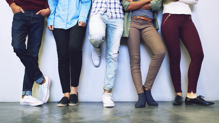 Fototapete - Waiting for the bell. Cropped shot of a group of unrecognizable university students standing in a corridor on campus.