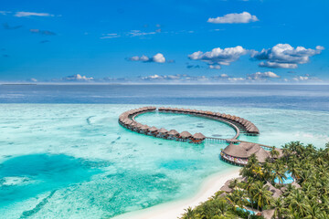 Wall Mural - Maldives paradise island. Tropical aerial landscape, seascape with jetty, water bungalows villas with amazing sea lagoon beach. Exotic tourism destination, summer vacation background. Aerial travel