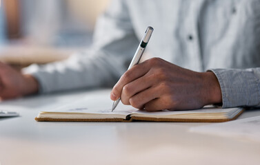 Poster - Planning and productivity go hand in hand. Shot of an unrecognisable businessman writing in a notebook during a late night at work.