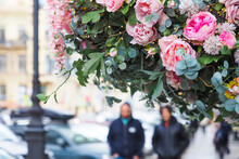 Compositon On Beautiful Pink Flowers Compositon On City Street, Sunlight. Wedding Scene