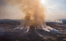 Aerial Panoramic View Of A Large Grassfire On Moorland In Wales