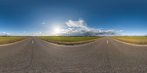 Wall Mural - full seamless spherical hdri panorama 360 degrees angle view on asphalt road among fields in summer evening sunset with awesome clouds in equirectangular projection, ready for VR AR virtual reality