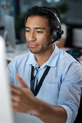 Aufkleber - Ill walk you through it. Shot of a young man using a headset and computer in a modern office.
