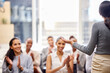© Alex S/peopleimages.com - Now that deserves a round f applause. Rearview shot of an unrecognizable young businesswoman giving a presentation in the boardroom.