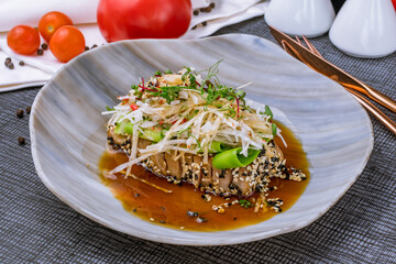 Sticker - Tuna tataki in pan-Asian sauce on plate