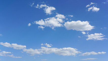 Wall Mural - blue sky with white clouds on sunny day, suitable for background or sky substitution