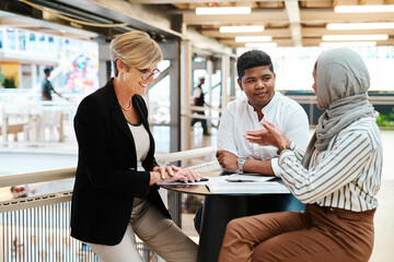 Poster - They each have brilliant ideas to share. Shot of a group of businesspeople having a discussion in an office.