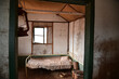 Remains of an old bedroom in abandoned house