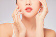 © Tuan  Nguyen  - A close view of model showing lip posing with hand for cosmetic advertising