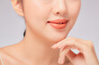 © Tuan  Nguyen  - A close view of model showing lip posing with hand for cosmetic advertising
