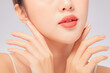 © Tuan  Nguyen  - A close view of model showing lip posing with hand for cosmetic advertising